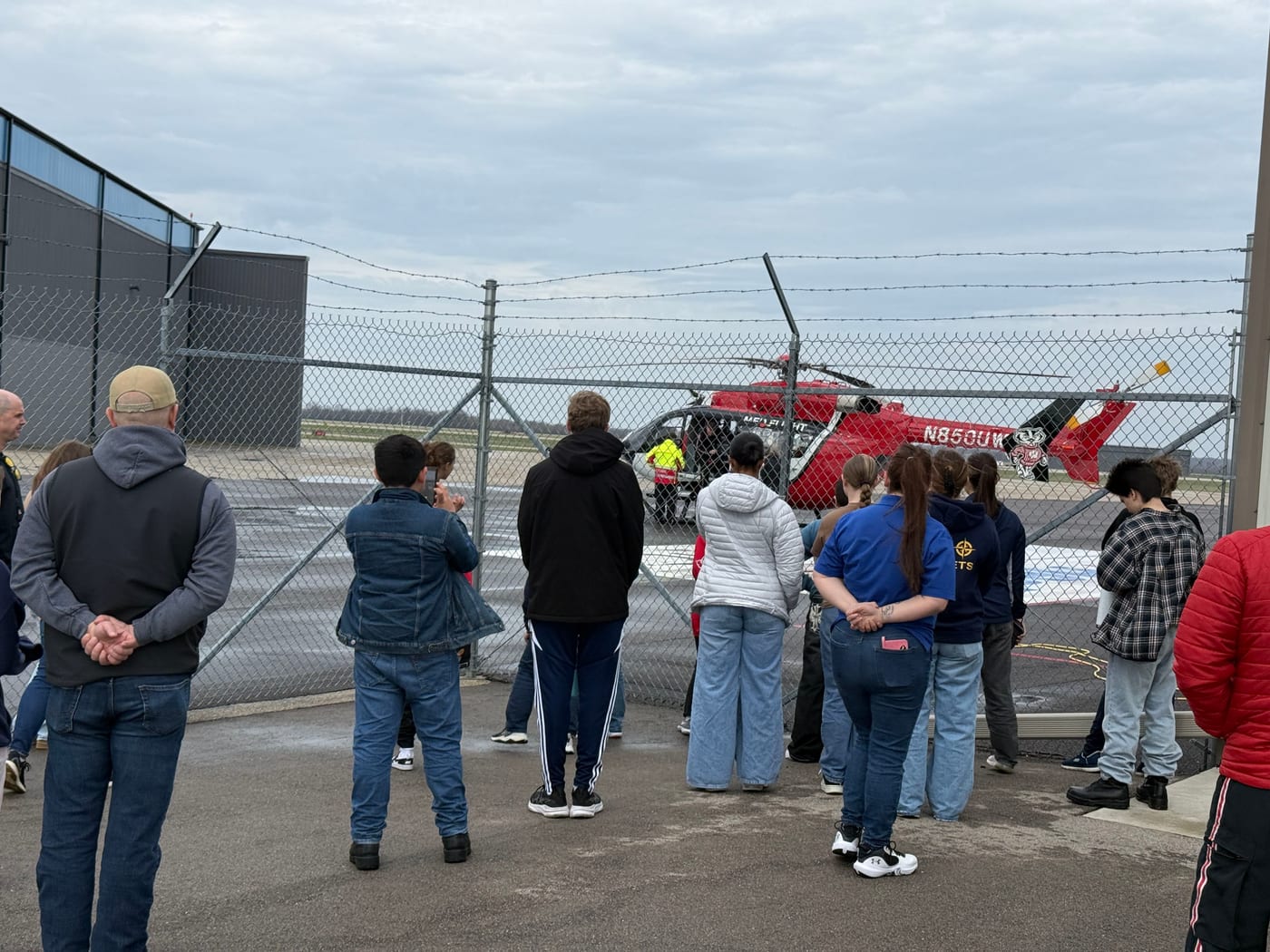 Cadets and families watching a medical helicopter up close during a field trip