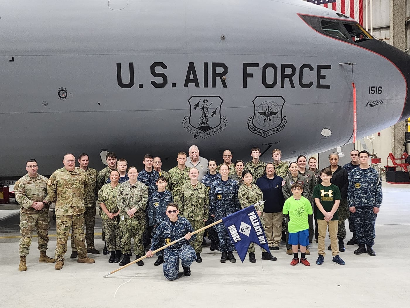 Cruiser Milwaukee cadets standing in front of a U.S. Air Force aircraft during an aviation training event