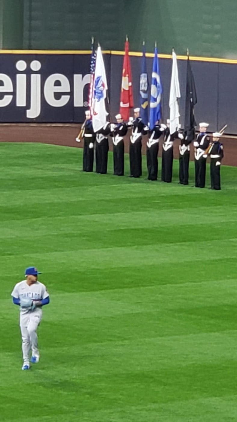 Cruiser Milwaukee Color Guard presenting flags on the field at American Family Field during a Brewers game