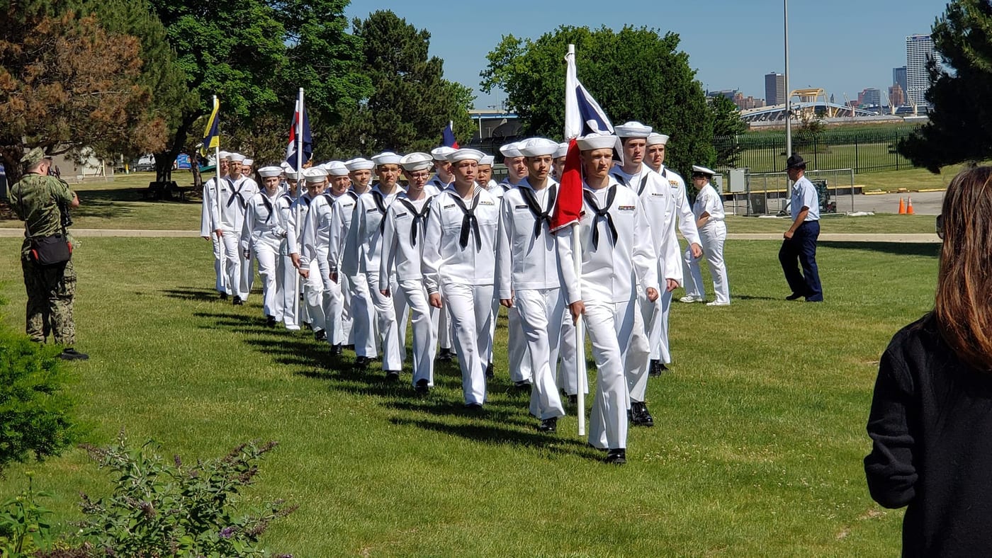 Cruiser Milwaukee cadets marching in formation outdoors during training