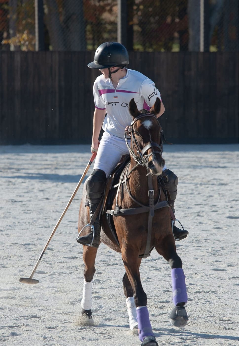 Ethan Harper competing in polo on horseback