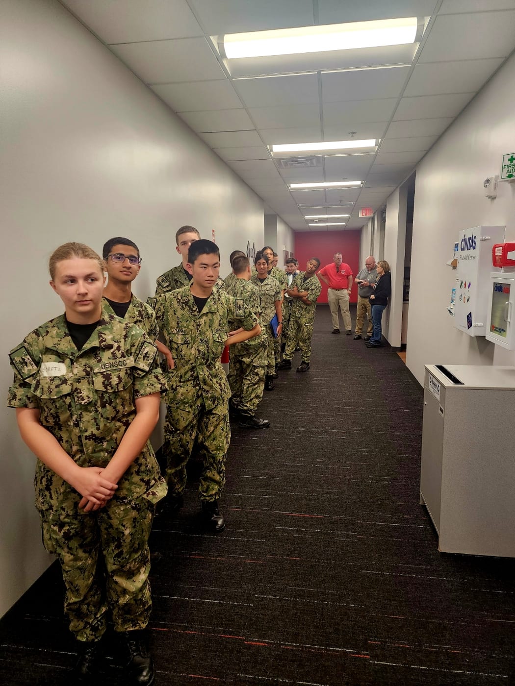 Kendra Ugoretz leading cadets in Navy Working Uniform during cybersecurity training