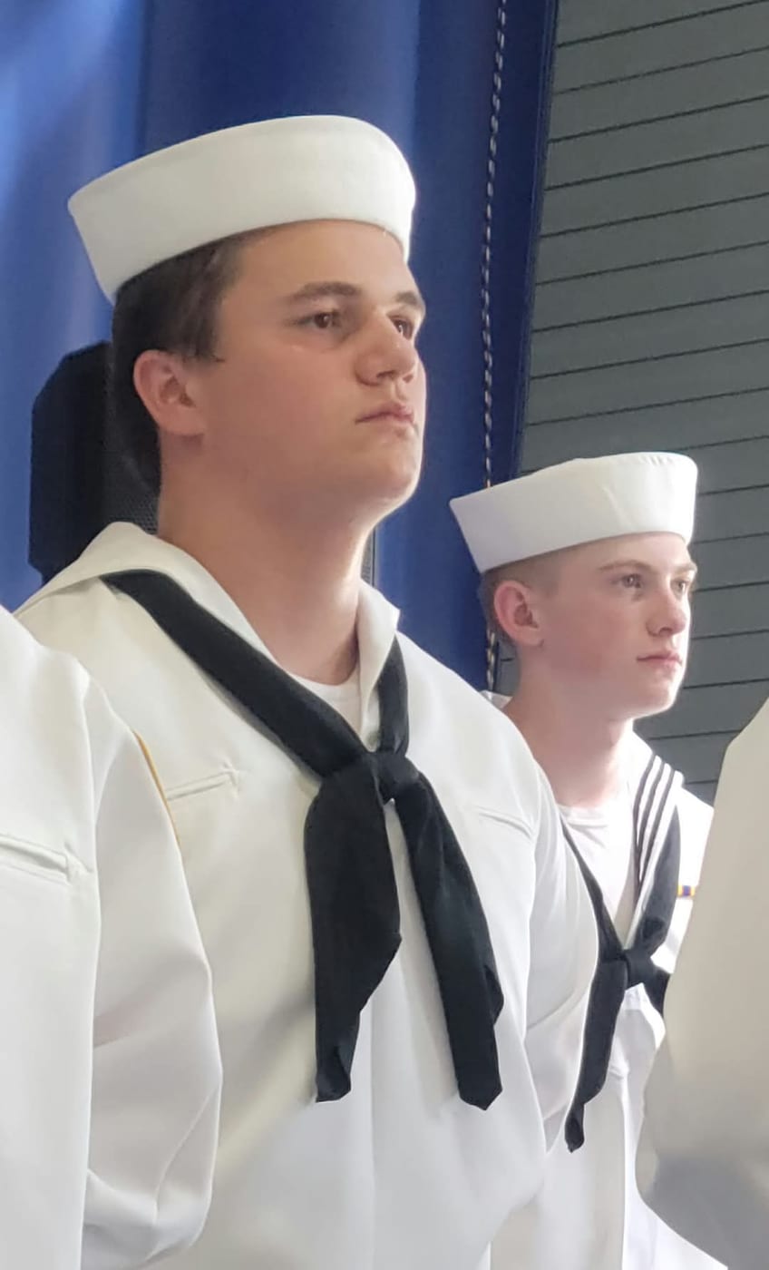 Karl Williams in white dress uniform at attention
